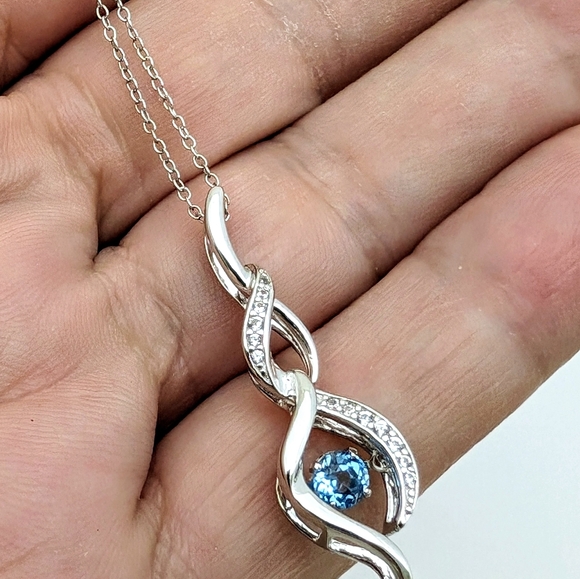 Sterling Silver Round Cut Sparkling Blue Topaz Infinity Pendant Necklace - Picture 5 of 9